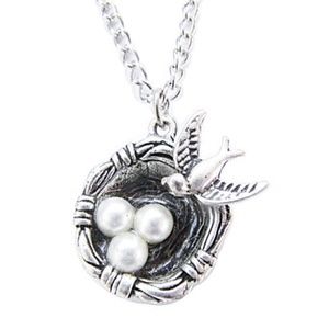 Silver bird nest pendant necklace